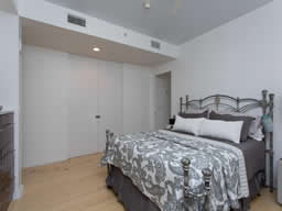 There's a walk-in closet with a European wardrobe inside.