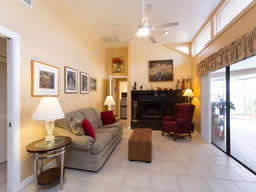 Relax in front of the wood-burning fireplace and look out at the water