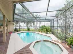 The screen enclosure ensures easy maintenance for the pool