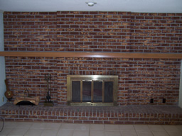 A brick fireplace makes a great focal point