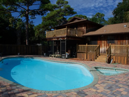 A gorgeous pool & spa has paver decking