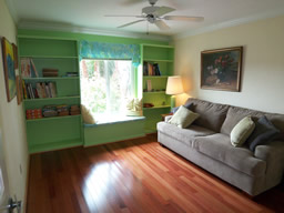 This bedroom has a window seat and built-ins.