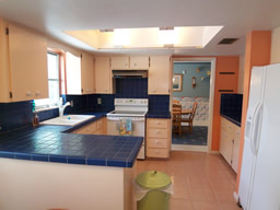 A cheery kitchen overlooks the pool, too.