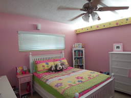 This bedroom gets lots of natural light.