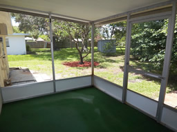 The back yard has orange and grapefruit trees