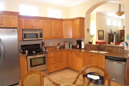 Note the granite counters and stainless steel appliances.