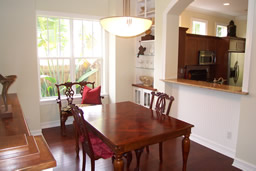 Built-in bookshelving and display niches surround the dining area.