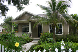 A white picket fence welcomes you home to this Craftsman-style bungalow.