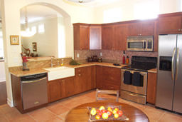 Gorgeous granite counters and wood cabinetry are rich and inviting.