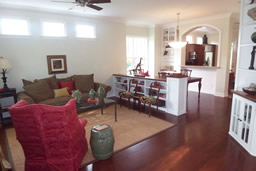 Just inside, gorgeous wood floors lead you into the living room.