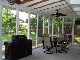 This lovely screened porch is the perfect place for outdoor entertaining
