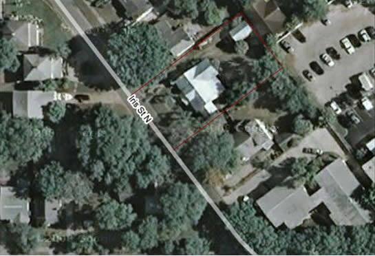 A view from above shows how green the neighborhood is with large, mature trees. 