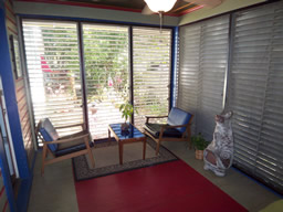 This relaxing sunroom overlooks the garden.