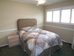 One of the other two bedrooms.