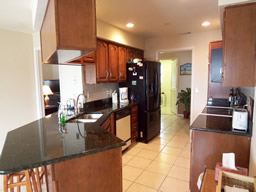 Granite counters & wood cabinets are nice!