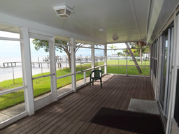 Enjoy the breezes under cover of this wide porch.