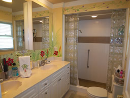 The bath has a double vanity and large shower