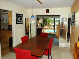 The dining room looks out at the water.