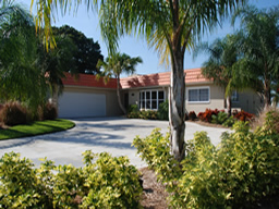 Lush tropical landscaping welcomes you home