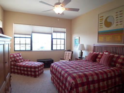 The Master bedroom on the main level, with a water view.