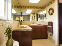 Adjacent to this remodeled bath is a walk-in closet.