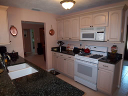 The central kitchen features a gas range