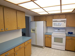 The kitchen has tons of cabinet space