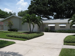 This home has great curb appeal, with trim landscaping and a side-entry garage