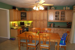 Custom cabinetry includes a desk area and a buffet/bar
