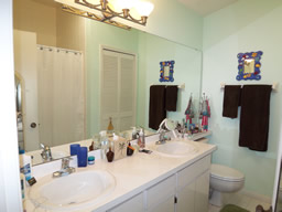 The bright Master bath has a wide vanity
