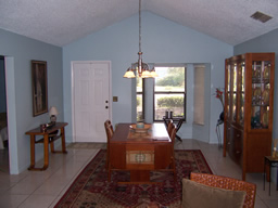 Just inside is a dining room with vaulted ceiling.