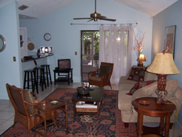 A spacious living room opens to the kitchen.