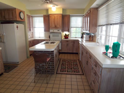  The bright kitchen looks out at the water