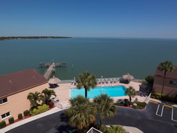 The community features a heated pool and a large dock.