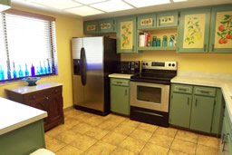 The kitchen has lots of cabinets and counter space