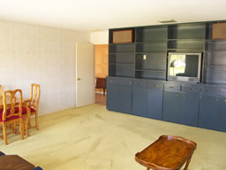 This third bedroom has built-in entertainment cabinetry