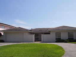 A circular drive leads to the home with its courtyard entrance.