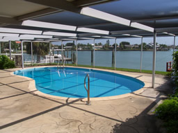 The screened pool has a wide deck for outdoor entertaining.