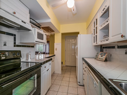 Functional galley design with a closet pantry.