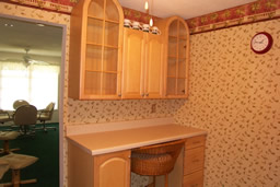  A casual dining counter and display cabinetry are key features.