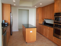 Wood cabinetry and stainless steel appliances.